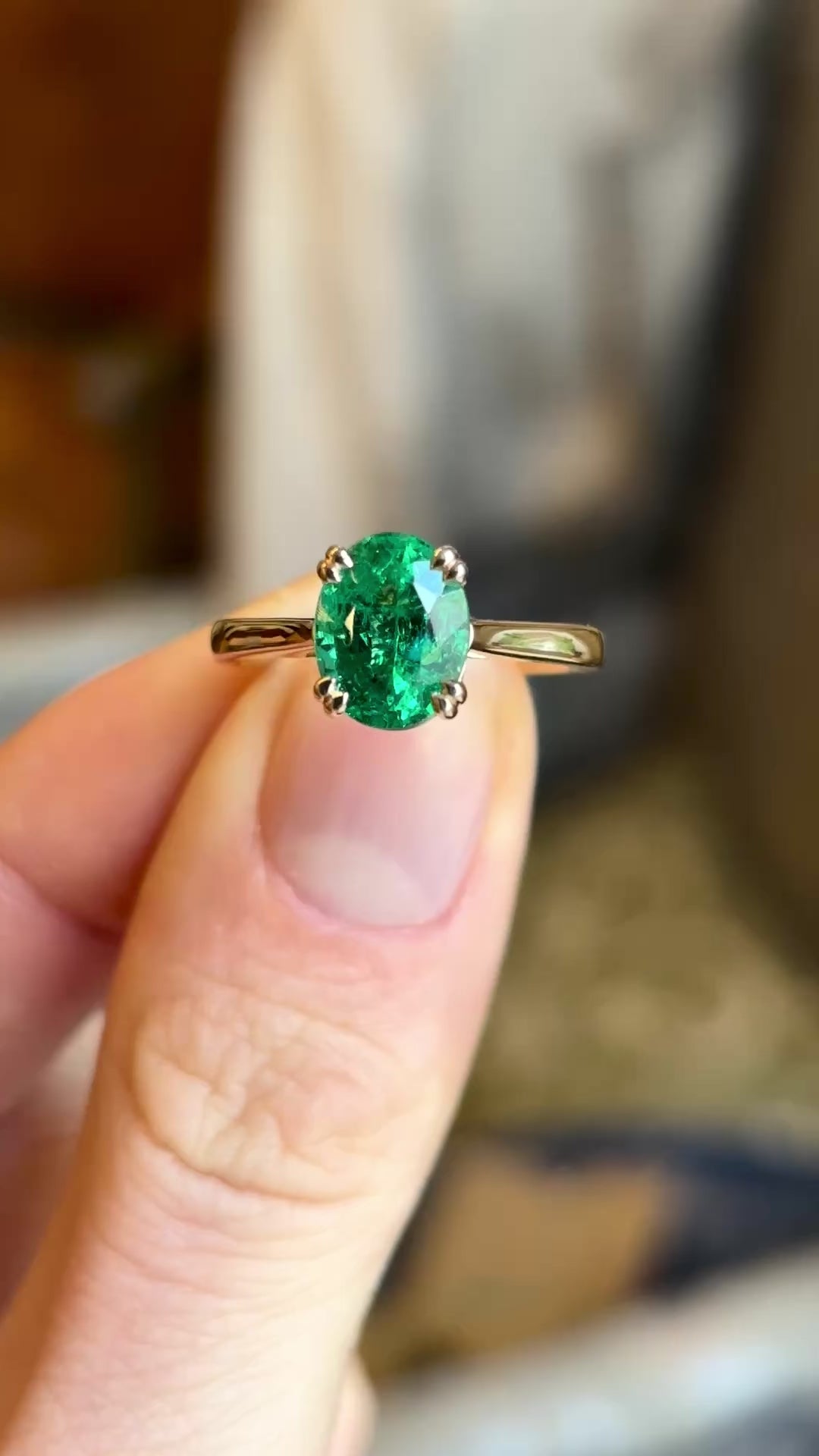 Oval-cut emerald single-stone ring