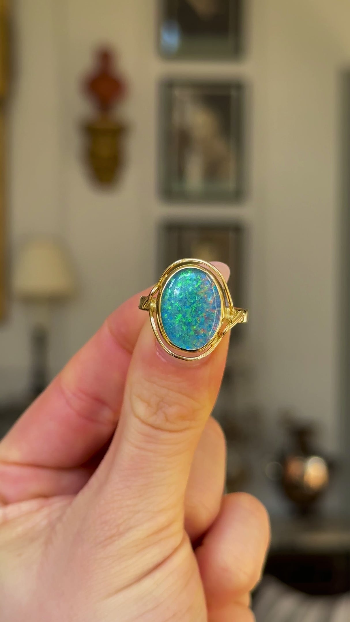 Vintage, Simulated Black Opal Cocktail Ring, 18ct Yellow Gold held in fingers and rotated to give perspective.