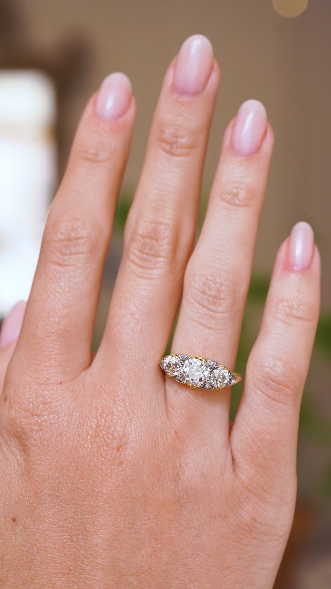A video showing a full-hand view of the late Victorian three-stone diamond ring, showing its elegant graduated spread across the finger.