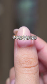 A video of Front view of an antique Edwardian seven-stone diamond ring