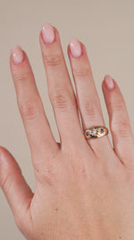A video of the antique Edwardian ring being worn, highlighting the contrast between the blue sapphires, central diamond and warm gold.