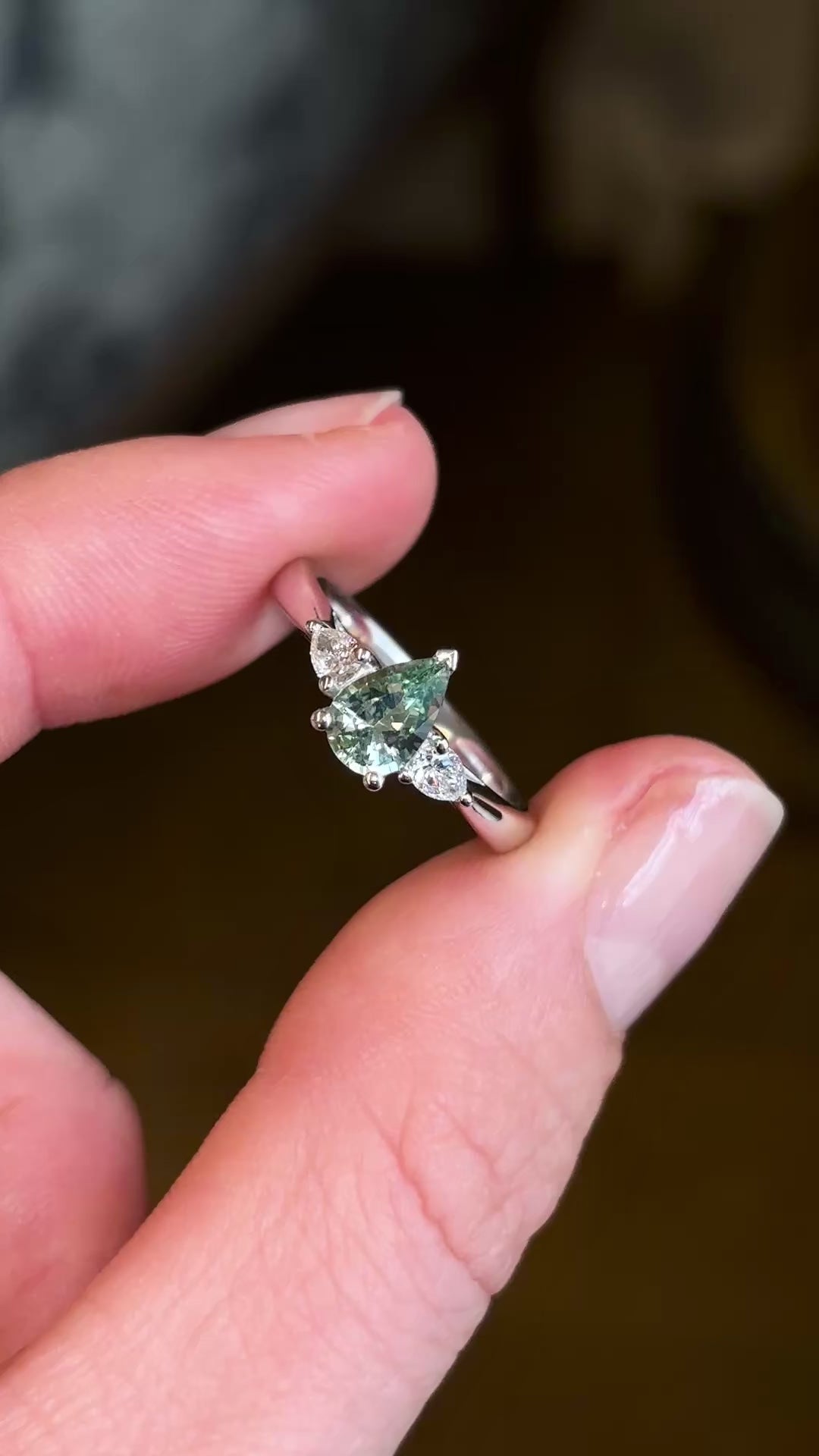 Pear-cut teal sapphire & diamond three-stone engagement ring