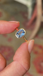 A close up video showing an Antique-inspired pale blue sapphire solitaire engagement ring.