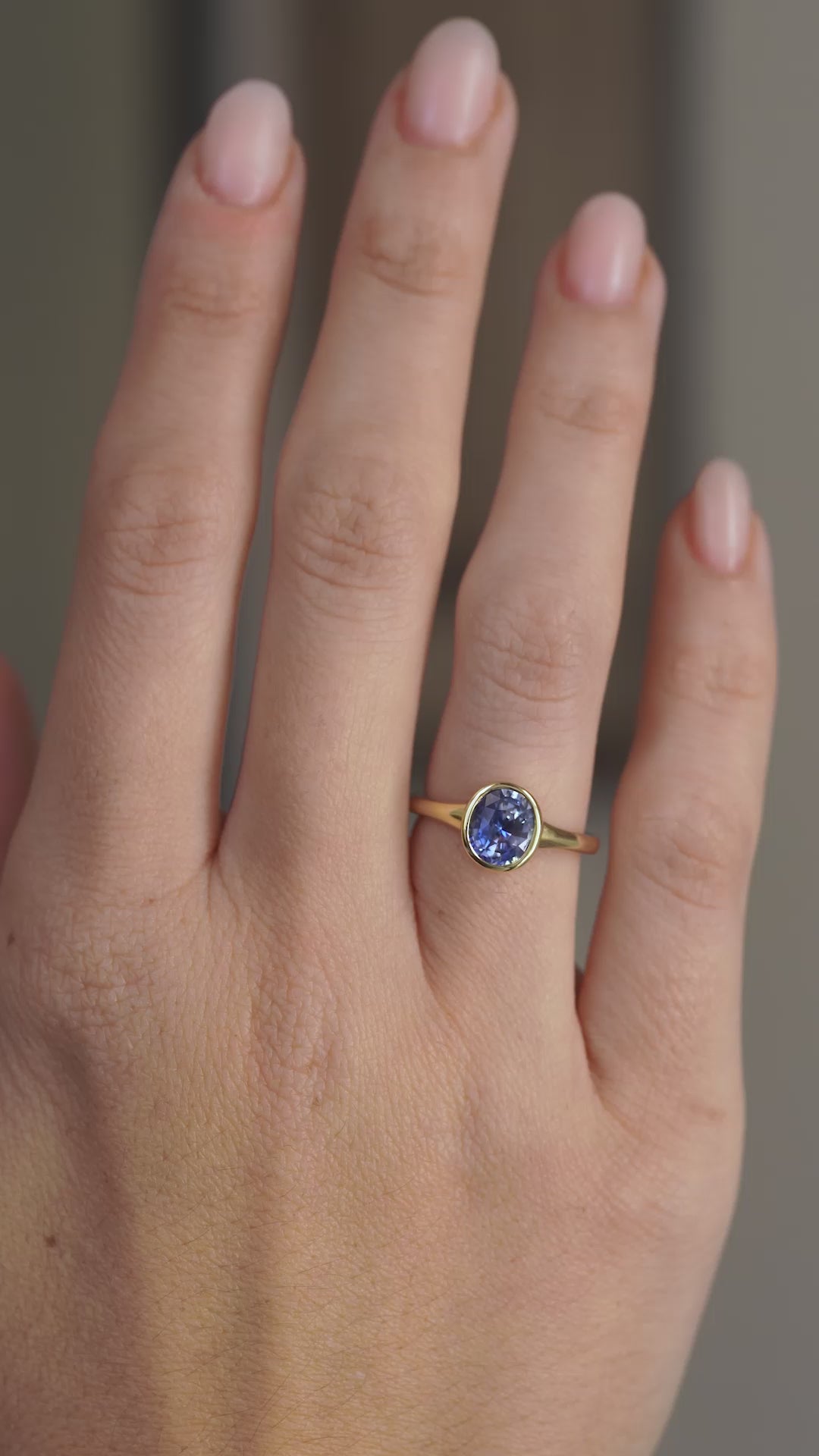 Video of the antique-inspired blue sapphire engagement ring worn on the hand, showing its refined proportions in motion.