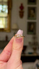 Antique four-stone diamond ring moved around to give perspective