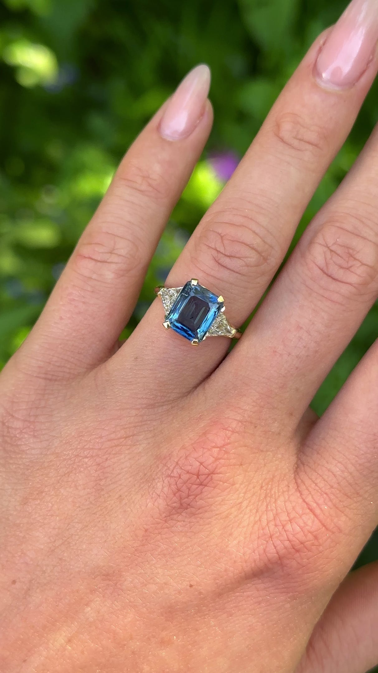 Vintage, Blue Sapphire and Trilliant-cut Diamond Three Stone ring, 18ct Yellow Gold worn on hand.
