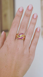 Video of the antique Victorian snake ring on the hand, highlighting the natural ruby details and polished gold movement.