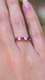 A video of an antique Edwardian ruby and old-cut diamond five-stone ring worn on the hand.