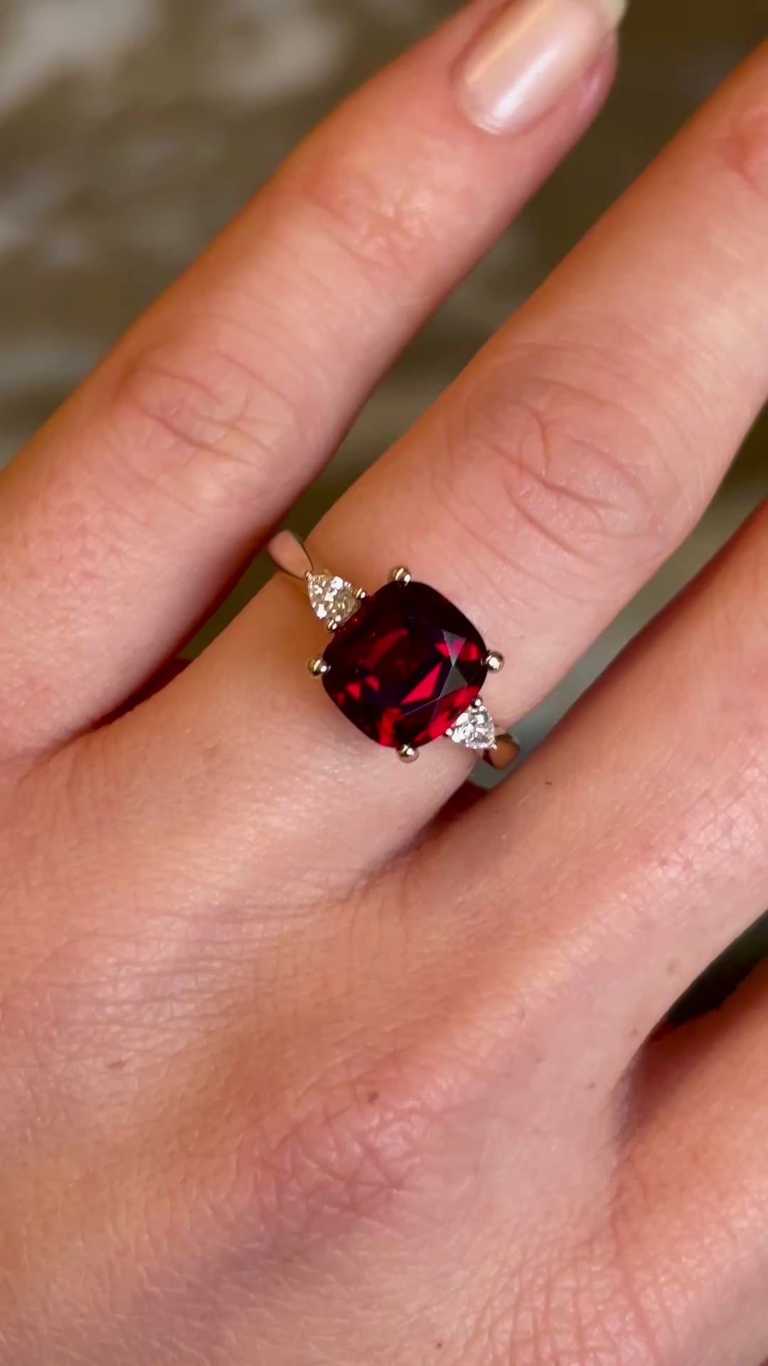 Ruby and diamond three-stone engagement ring