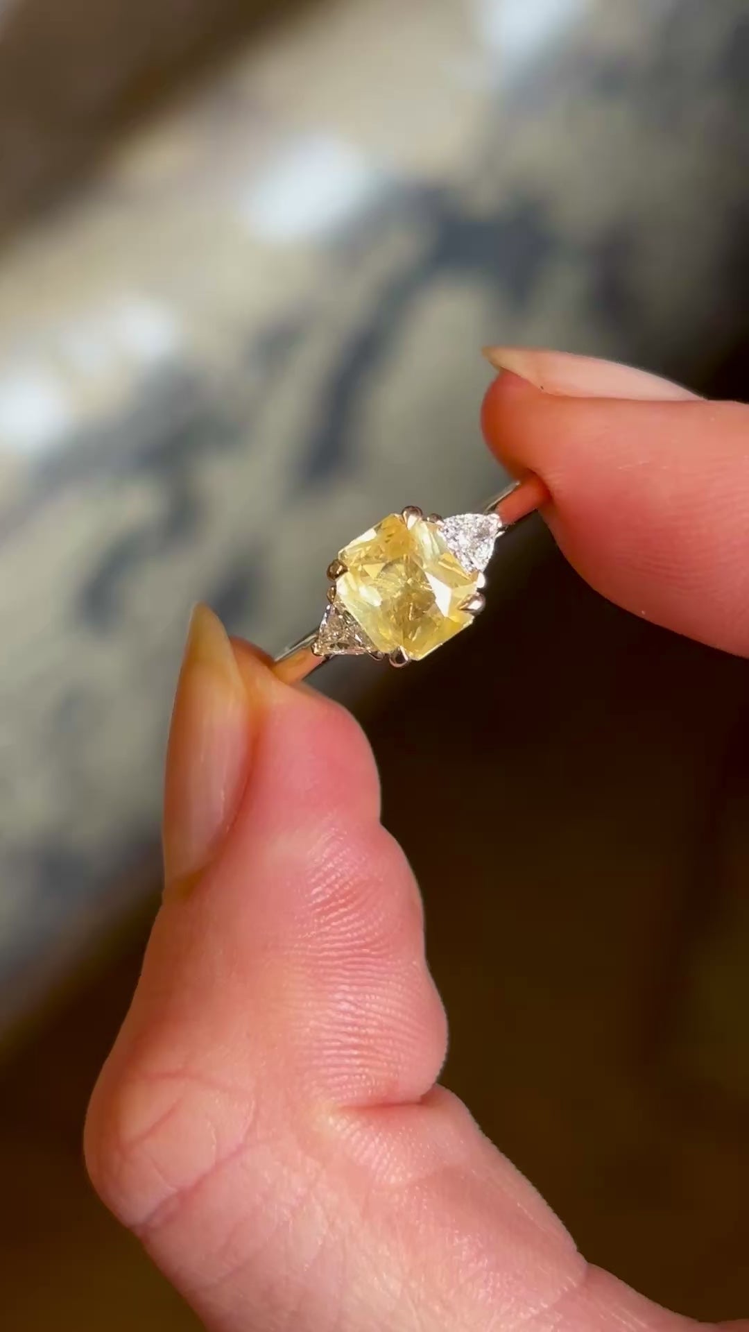 Yellow sapphire and diamond three-stone ring