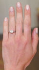 Tinted yellow diamond ring worn on hand with natural movement.
