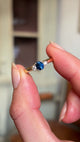 Blue sapphire and diamond three-stone engagement ring