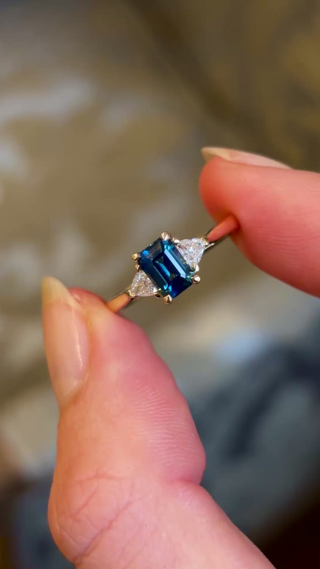 Teal sapphire and diamond three-stone engagement ring
