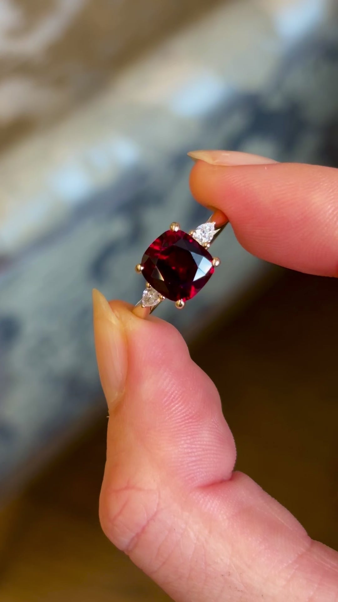 Ruby and diamond three-stone engagement ring