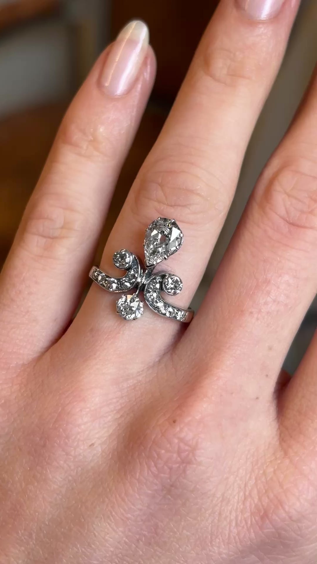 Antique, Edwardian pear cut diamond motif engagement ring
