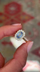 Video of an Antique-inspired, blue sapphire and diamond cluster engagement ring in yellow gold, rotated to show all the angles of the ring