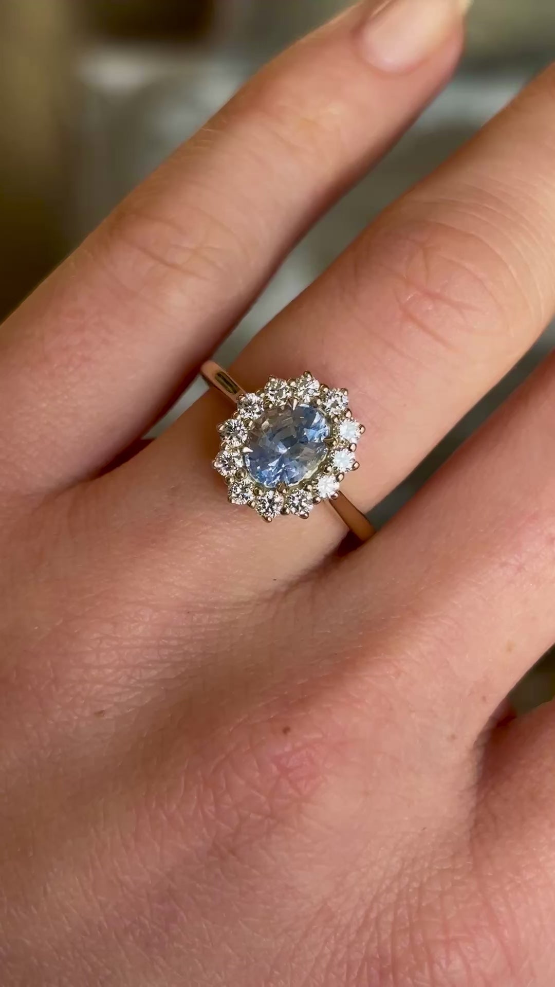 Cornflower blue sapphire and diamond cluster engagement ring