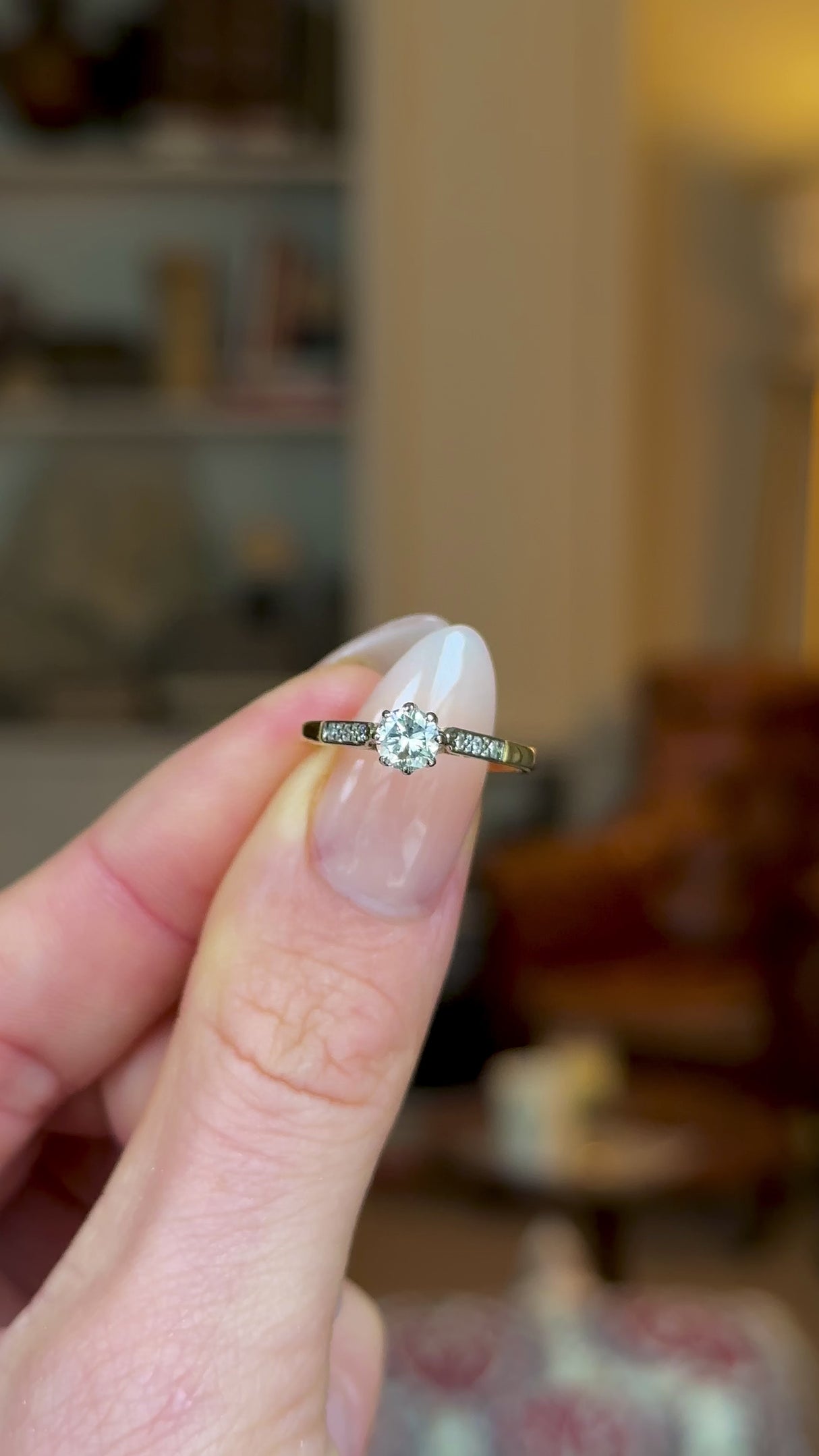 Antique, Edwardian Solitaire Diamond Engagement Ring, 18ct Yellow Gold and Platinum held in fingers and rotated to give perspective.