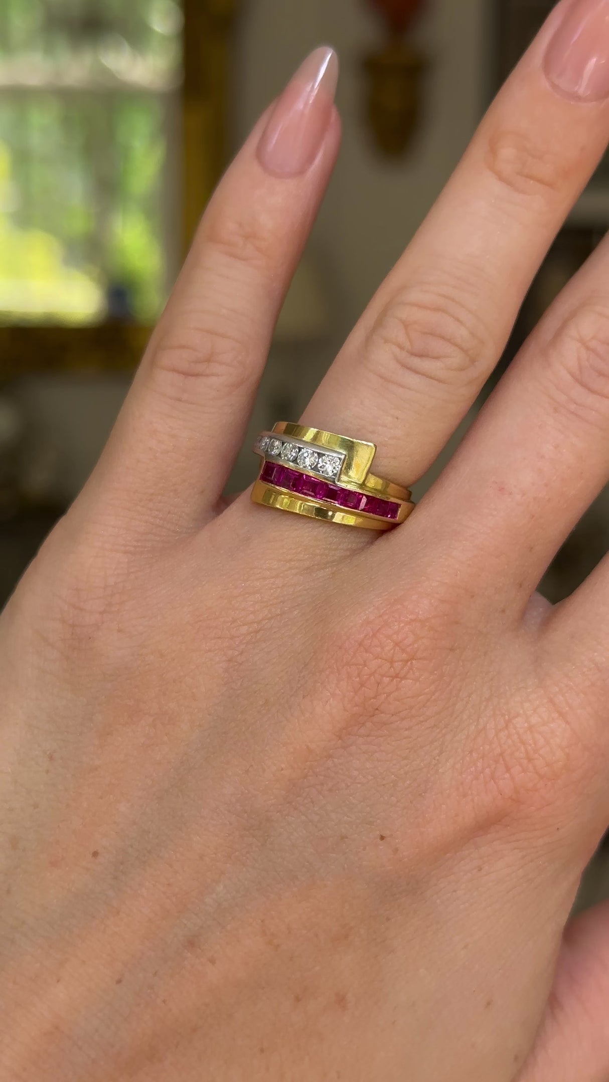 Retro Tiffany & Co. ruby and diamond ring  worn on hand and moved around to give perspective.