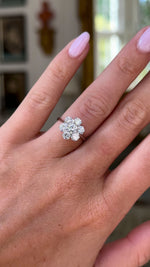 vintage diamond cluster ring, worn on hand and moved around to give perspective.