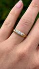 Antique, Edwardian five-stone diamond ring front worn on hand