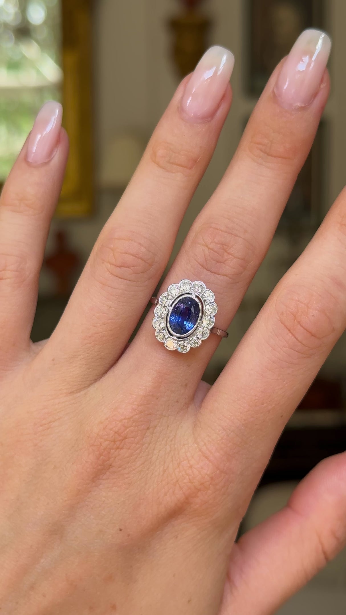 2.5ct oval blue sapphire and diamond cluster ring, 18ct white gold