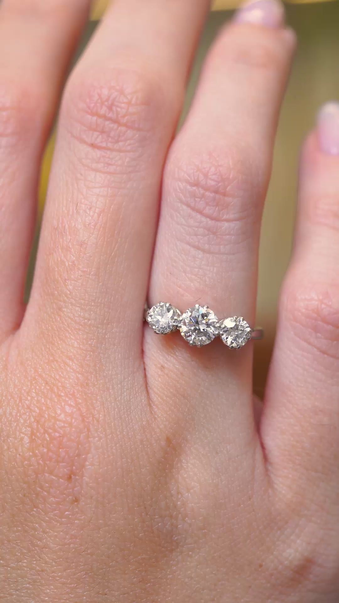 Video of antique old-cut diamond trilogy ring being worn on the hand