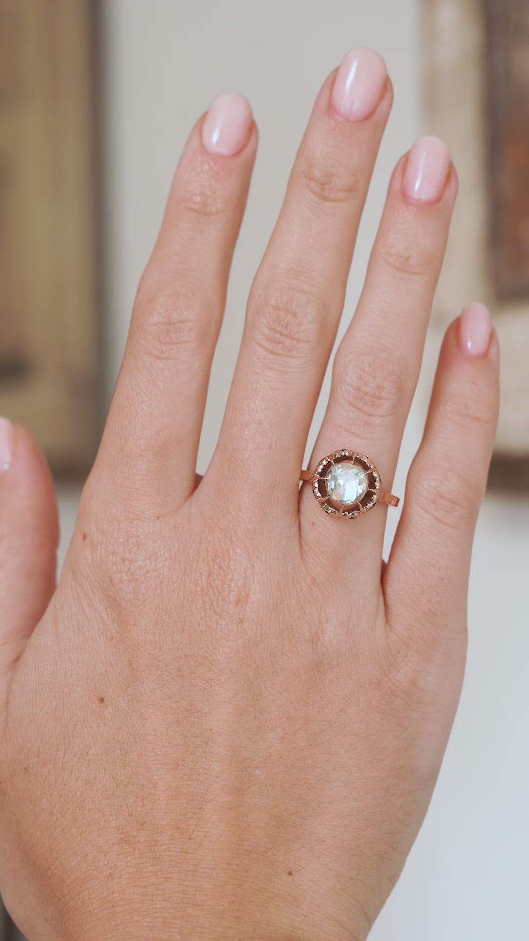 Video of the antique diamond ring on the hand, demonstrating its scale, subtle rainbow reflections and unusual period design.