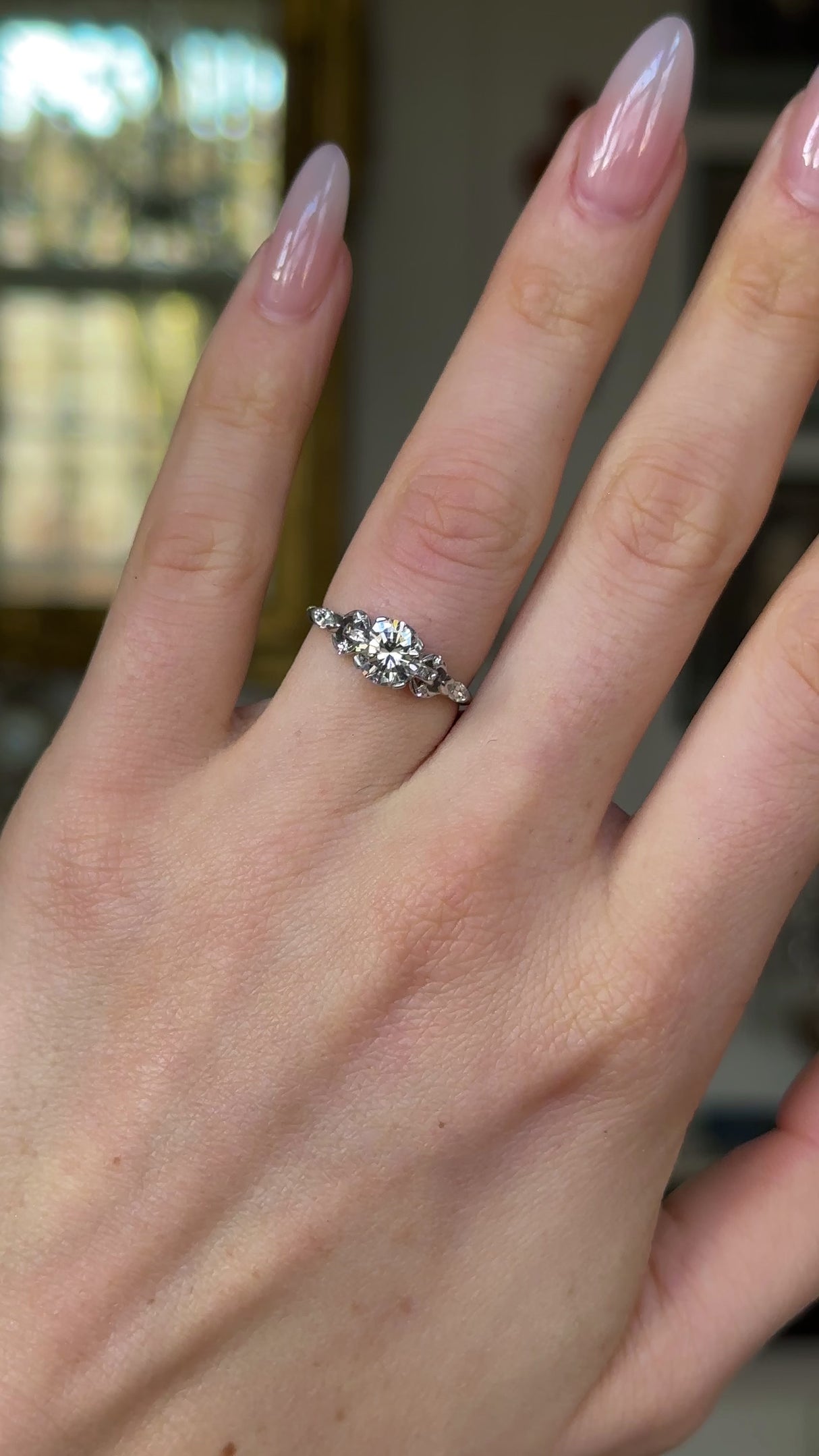 Vintage, 1950s Diamond Engagement Ring, 14ct White Gold and Platinum worn on hand and rotated to give perspective.