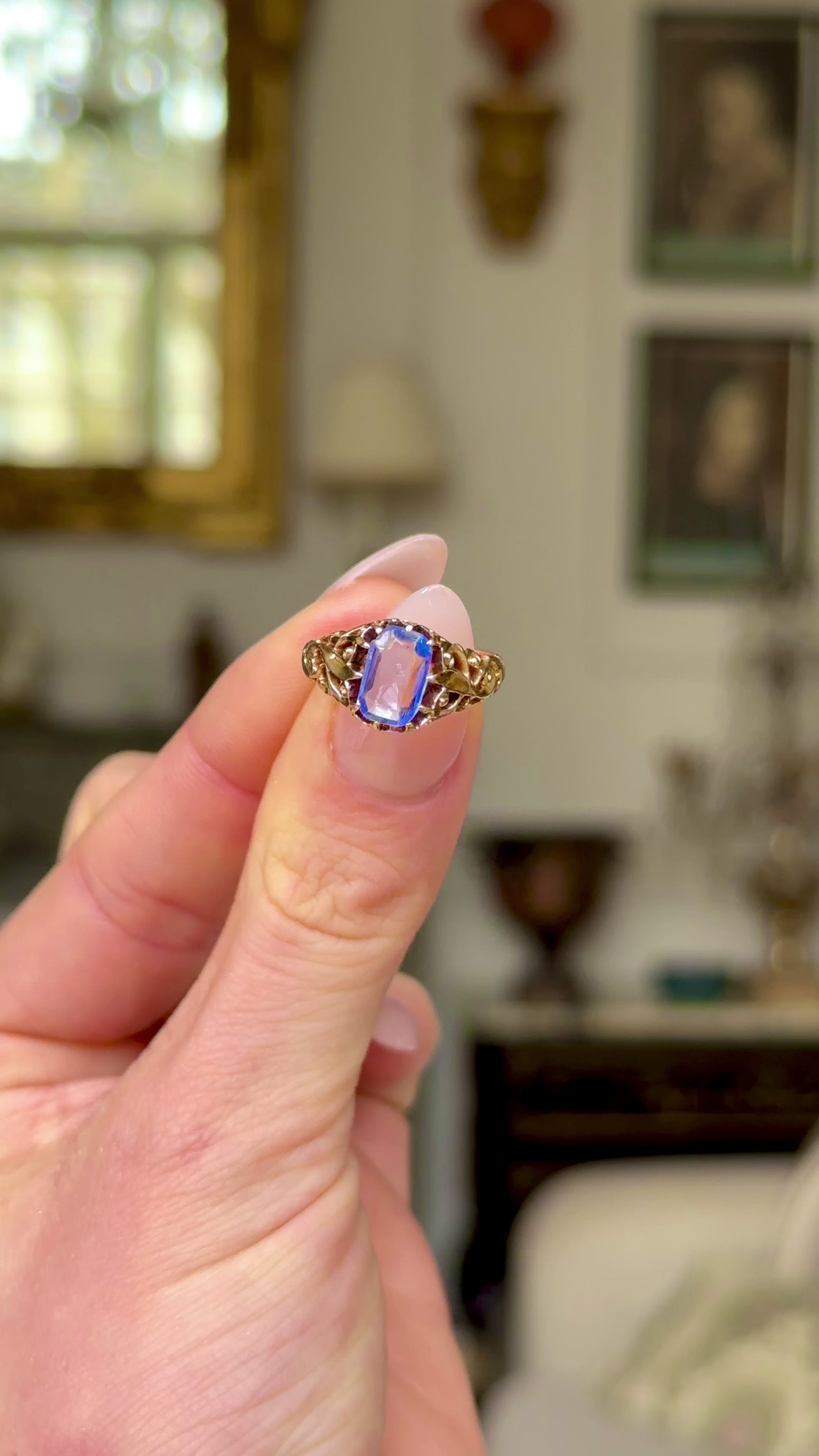 Antique, Victorian Ceylon Sapphire Ring, held in fingers and moved around to give perspective.
