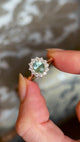 Green sapphire and diamond cluster engagement ring