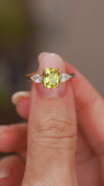 A video of an Antique-inspired yellow sapphire and diamond three-stone ring in yellow old being turned to show off angles.