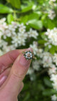 Vintage, 1970s Cognac Diamond, Emerald and White Spinel Ring, 9ct Yellow Gold held in fingers.