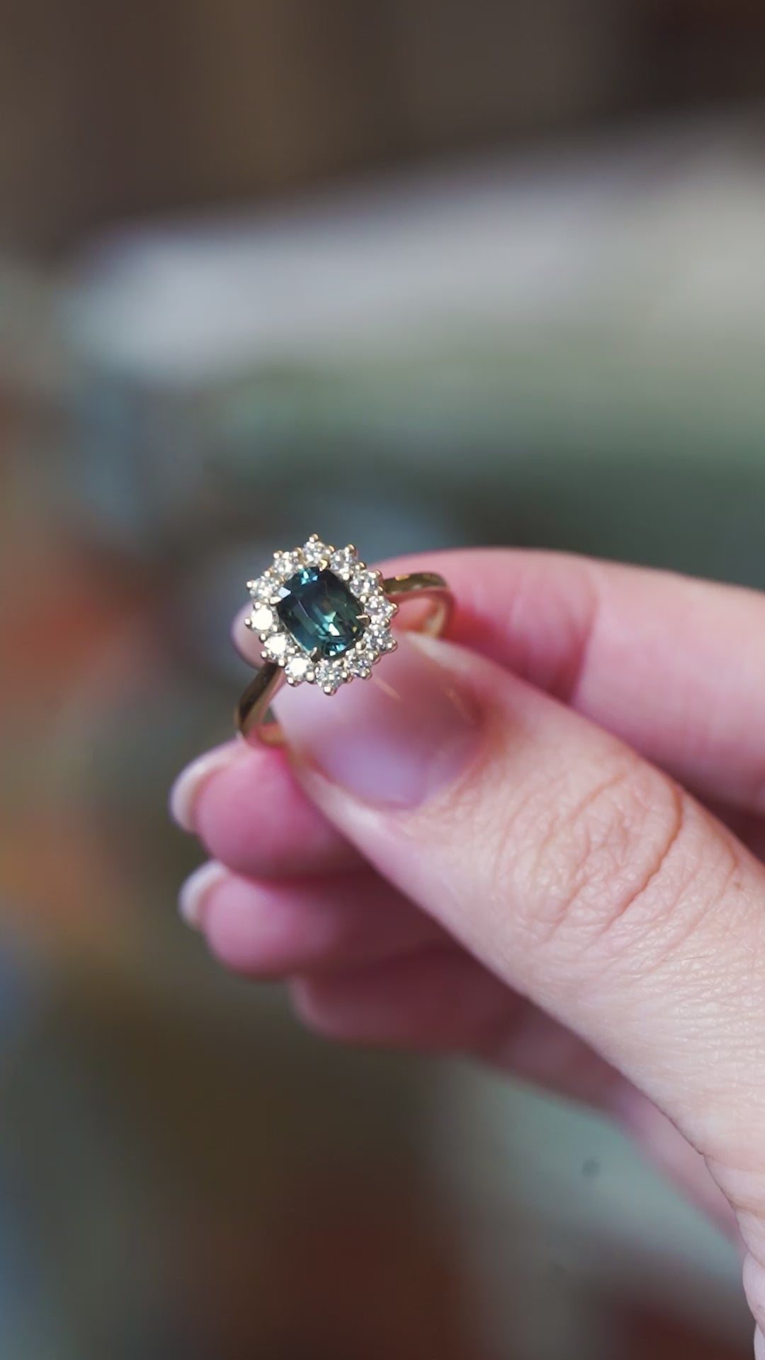 Green sapphire and diamond cluster engagement ring