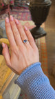 Antique-inspired, inky blue sapphire solitaire ring