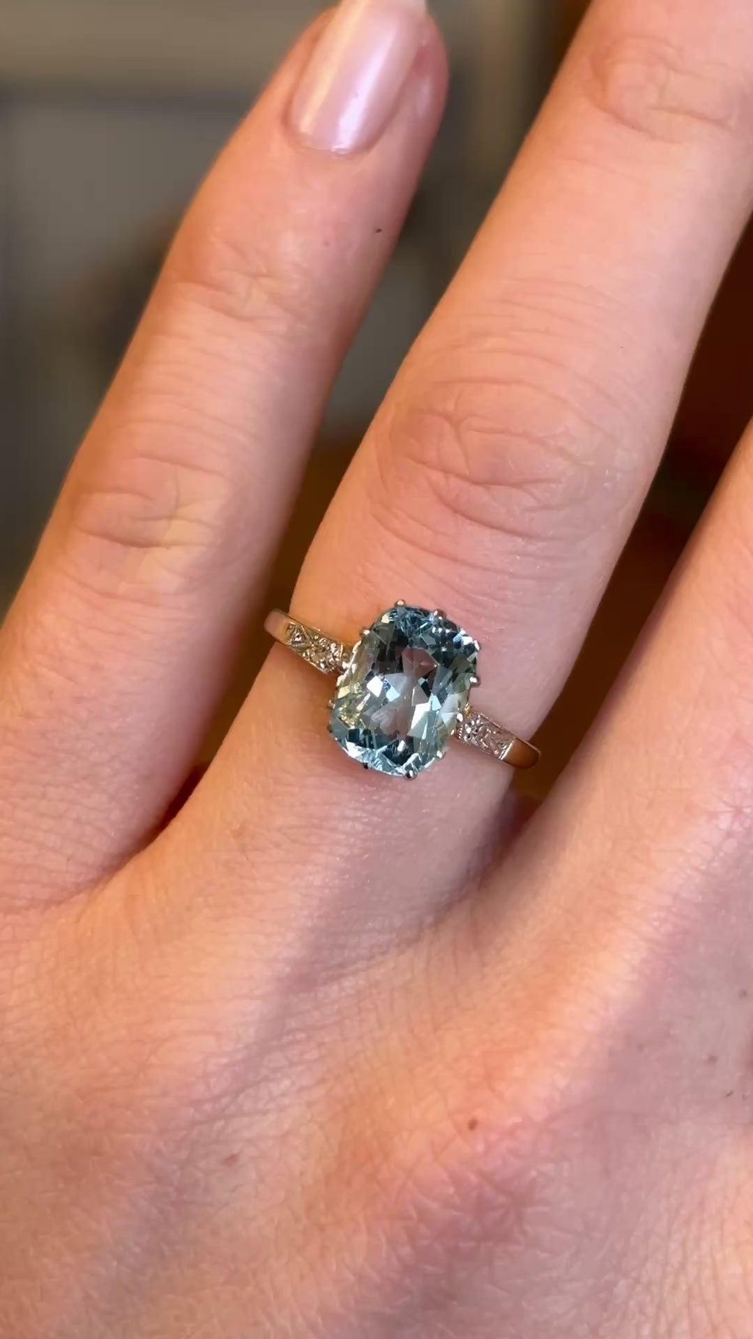 Video of an antique Edwardian cushion-cut aquamarine and diamond engagement ring worn on the hand, highlighting sparkle and colour in motion.