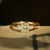 Princess cut 1.01ct yellow diamond and side diamonds three stone engagement ring in yellow gold