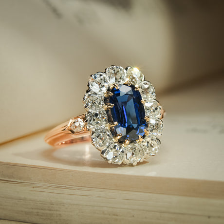 Royal blue sapphire antique ring with diamond cluster in Jugendstil style