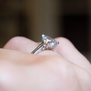 Vintage 1990s salt and pepper diamond solitaire ring with elevated pear-shaped diamond side profile.