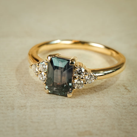 Teal sapphire trefoil diamond engagement ring with gold band