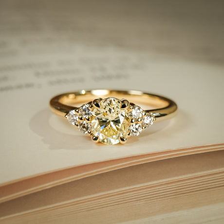 Trefoil yellow diamond cluster engagement ring with yellow gold band