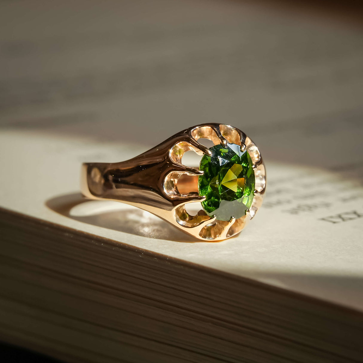 Victorian green zircon ring with round green gemstone in gold setting