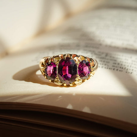 Victorian rhodolite garnet ring with three stone setting in gold