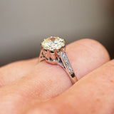 Vintage diamond ring showing raised setting and diamond detail along the band.