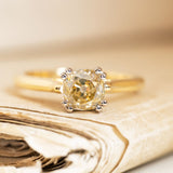 Vintage 1950s brown old-mine cut diamond solitaire ring set with a warm coloured diamond in yellow gold.
