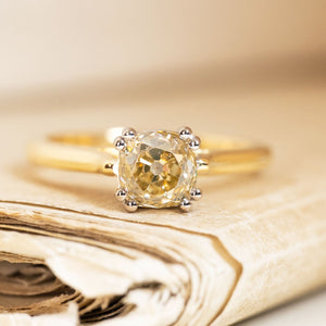 Vintage 1950s brown old-mine cut diamond solitaire ring set with a warm coloured diamond in yellow gold.