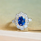 Vintage 1960s French sapphire and diamond cluster ring with vivid blue sapphire and brilliant diamond halo.
