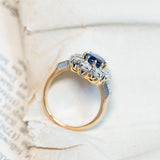 Vintage 1960s French sapphire and diamond cluster ring showing open gallery setting and diamond shoulders.