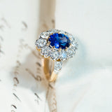 Vintage 1960s French sapphire and diamond cluster ring with rich blue sapphire and sparkling diamond cluster setting.