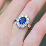 Vintage 1960s French sapphire and diamond cluster ring with oval sapphire centre surrounded by brilliant diamonds.
